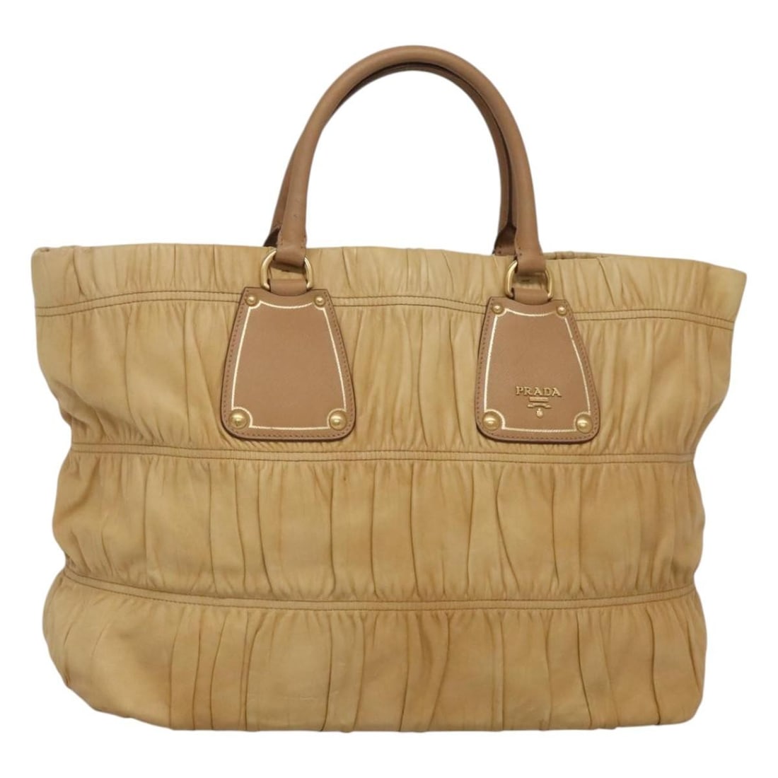 Beige Prada Gaufre Tote Bag in Nappa Leather for Women: Beige Prada Gaufre Tote Bag in Nappa Leather for Women This Prada Gaufre Tote is crafted from beige Nappa leather and features a ruched design. The tote is designed for women and made in Italy. It sho