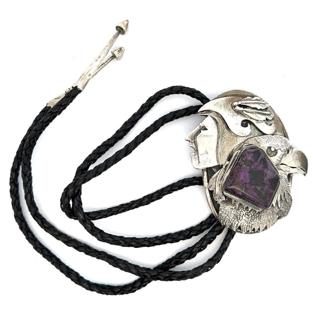 Sterling Silver Bolo Tie with Charoite Warrior and Eagle by Dan Nieto: Sterling Silver Bolo Tie with Charoite Warrior and Eagle by Dan Nieto This large bolo tie features a custom-cut, natural charoite stone in a medium to dark purple hue, bezel set in sterling silver. Th
