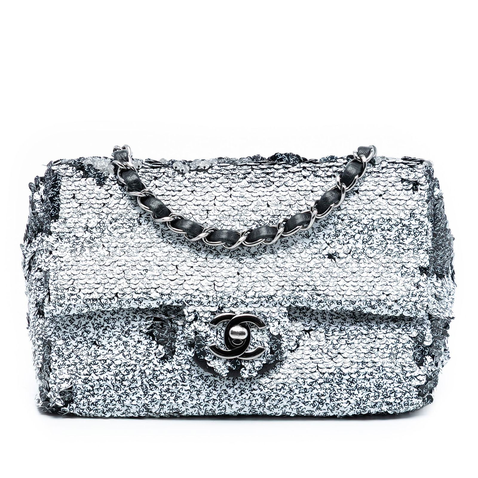 Chanel CC Sequin Single Flap Bag with Leather Chain Strap: Chanel CC Sequin Single Flap Bag with Leather Chain Strap This Chanel CC Printed Sequin Single Flap bag features a sequin exterior, leather-woven chain straps, a front flap with a turn lock closure, a