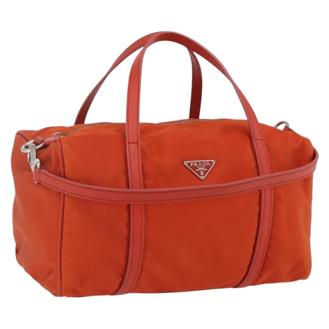 Orange Nylon PRADA 2way Handbag with Silver Accents and Shoulder Strap: Orange Nylon PRADA 2way Handbag with Silver Accents and Shoulder Strap This PRADA handbag features a vibrant orange nylon exterior with silver accents and offers versatile 2-way carrying options. It i