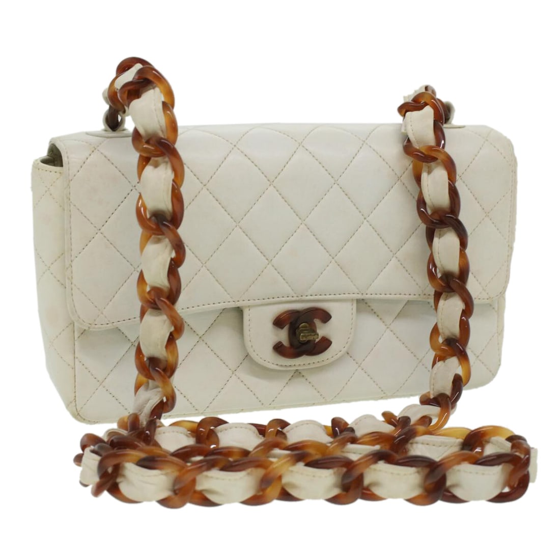 White Quilted Lambskin Single Flap Bag by Chanel Vintage: White Quilted Lambskin Single Flap Bag by Chanel Vintage This Chanel Vintage Classic Single Flap Bag is crafted from white quilted lambskin leather, designed for women. The bag features a compact silh