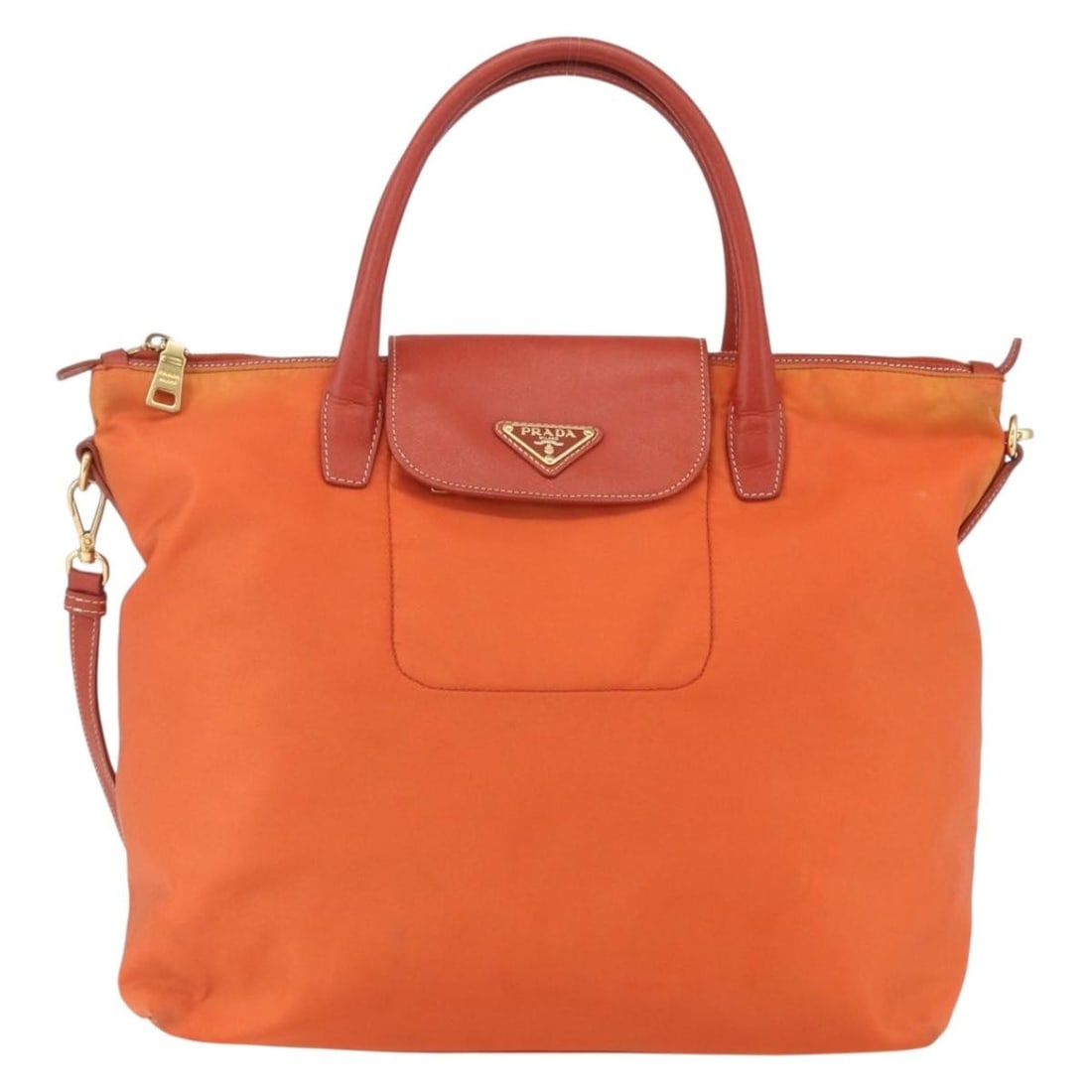 Prada Orange Convertible Flap Tote Nylon with Saffiano Leather Trim: Prada Orange Convertible Flap Tote Nylon with Saffiano Leather Trim This Prada Convertible Flap Tote for women features a vibrant orange nylon body with Saffiano leather accents. The tote offers a ver