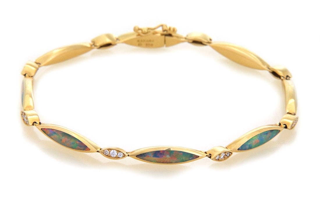 18k Yellow Gold Bracelet with Fire Opal and Diamond Marquise Links by Kabana: 18k Yellow Gold Bracelet with Fire Opal and Diamond Marquise Links by Kabana This authentic Kabana bracelet is crafted from 18k yellow gold and features a marquise link design. It is set with fire opa