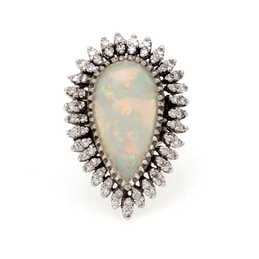 Vintage 14k White Gold Fire Opal 14.00ct Diamond Cocktail Ring: Vintage 14k White Gold Fire Opal 14.00ct Diamond Cocktail Ring This stunning vintage cocktail ring is an exquisite combination of elegance and craftsmanship. Made from 14k white gold, it features a ca