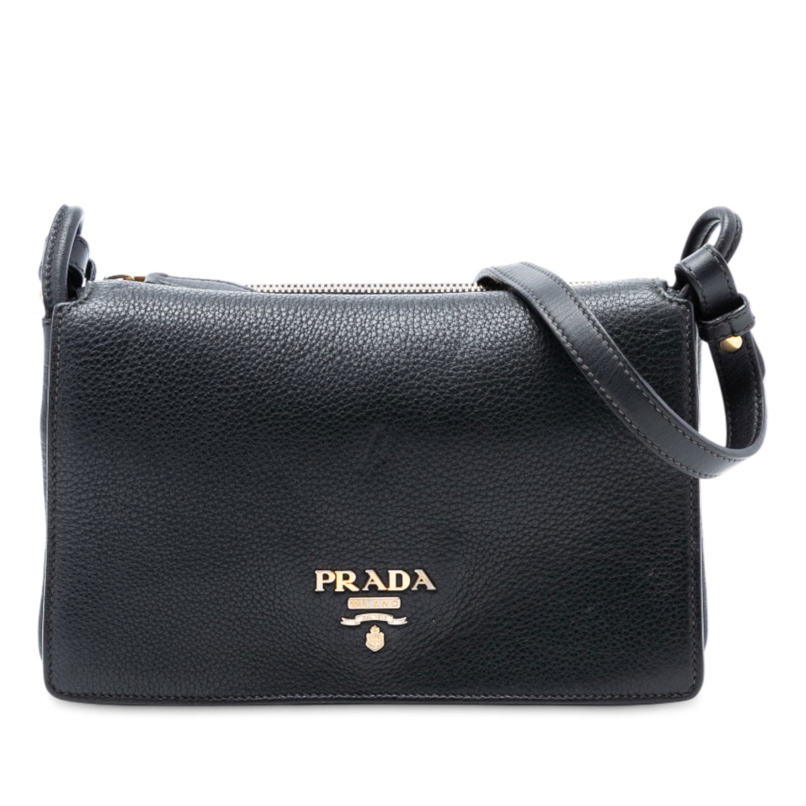 Black Prada Vitello Daino Leather Crossbody Bag with Flap and Zip Pocket: Black Prada Vitello Daino Leather Crossbody Bag with Flap and Zip Pocket This Prada Vitello Daino Flap Crossbody bag features a black leather exterior, an adjustable flat leather strap, a top flap wit