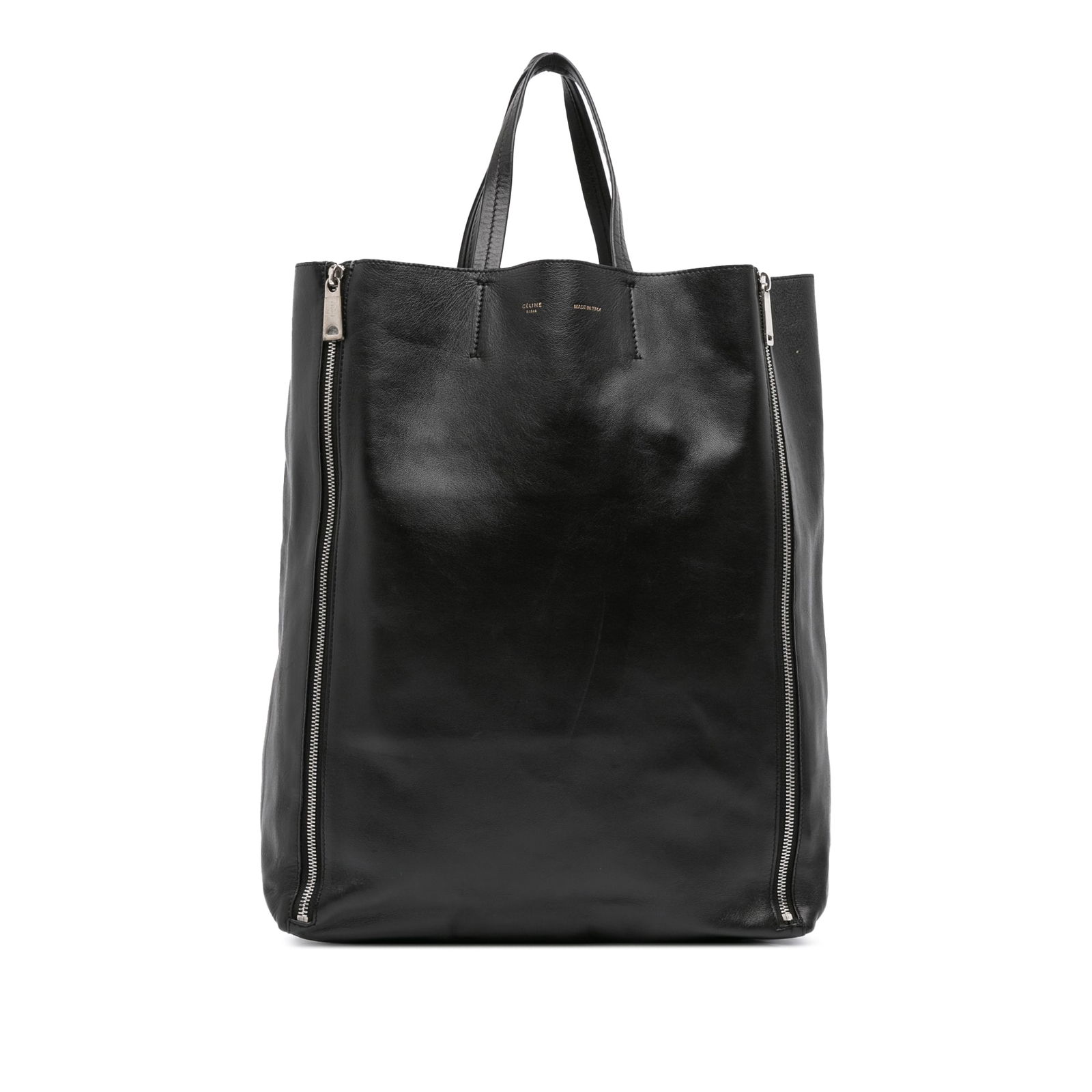 Celine Black Lambskin Vertical Zip Cabas Tote Bag: Celine Black Lambskin Vertical Zip Cabas Tote Bag The Celine Lambskin Vertical Zip Cabas Tote is a sophisticated accessory, crafted from luxurious lambskin leather in a classic black hue. This tote fe