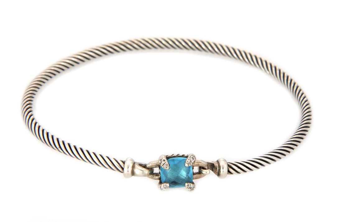 David Yurman Sterling Silver Hook Bangle with Blue Topaz and Diamonds: David Yurman Sterling Silver Hook Bangle with Blue Topaz and Diamonds Elevate your accessory collection with this elegant David Yurman Hook Bangle, crafted from high-quality sterling silver. The bangl