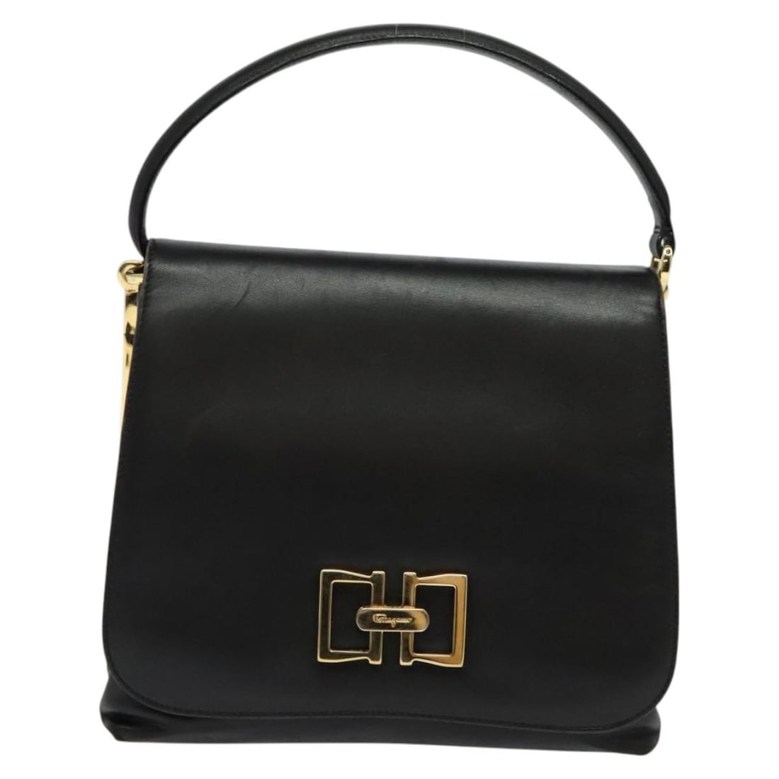 Black Leather Vintage Salvatore Ferragamo Handbag from Italy: Black Leather Vintage Salvatore Ferragamo Handbag from Italy This Salvatore Ferragamo vintage handbag is crafted from black leather and designed for women. Made in Italy, it features a classic silhoue