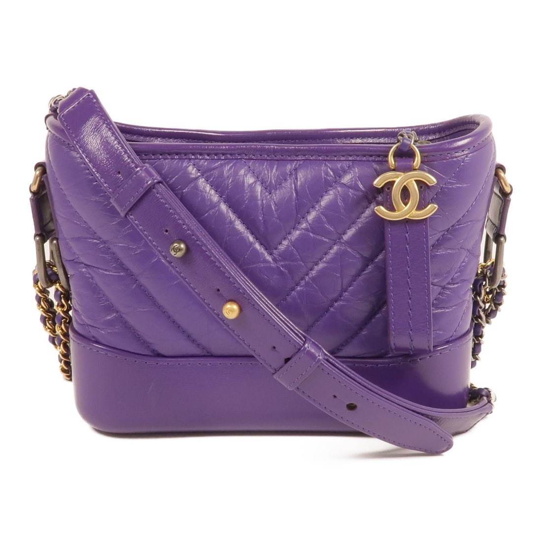 Purple Calfskin Chanel Gabrielle Mini Shoulder Bag with Chain Strap: Purple Calfskin Chanel Gabrielle Mini Shoulder Bag with Chain Strap This CHANEL Gabrielle Mini Crossbody Chain Shoulder Bag is crafted from purple calfskin leather and features a chic CC design. Made