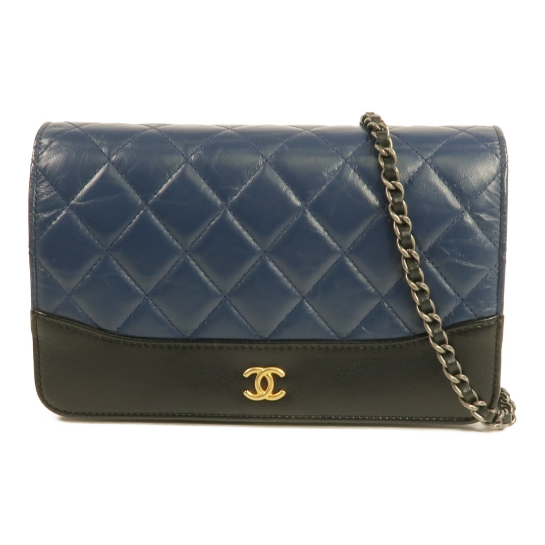 Chanel Wallet on Chain Lambskin Shoulder Bag in Black with Gold Hardware: Chanel Wallet on Chain Lambskin Shoulder Bag in Black with Gold Hardware This CHANEL Wallet On Chain (WOC) shoulder bag is crafted from luxurious lambskin leather in black with subtle blue undertones.