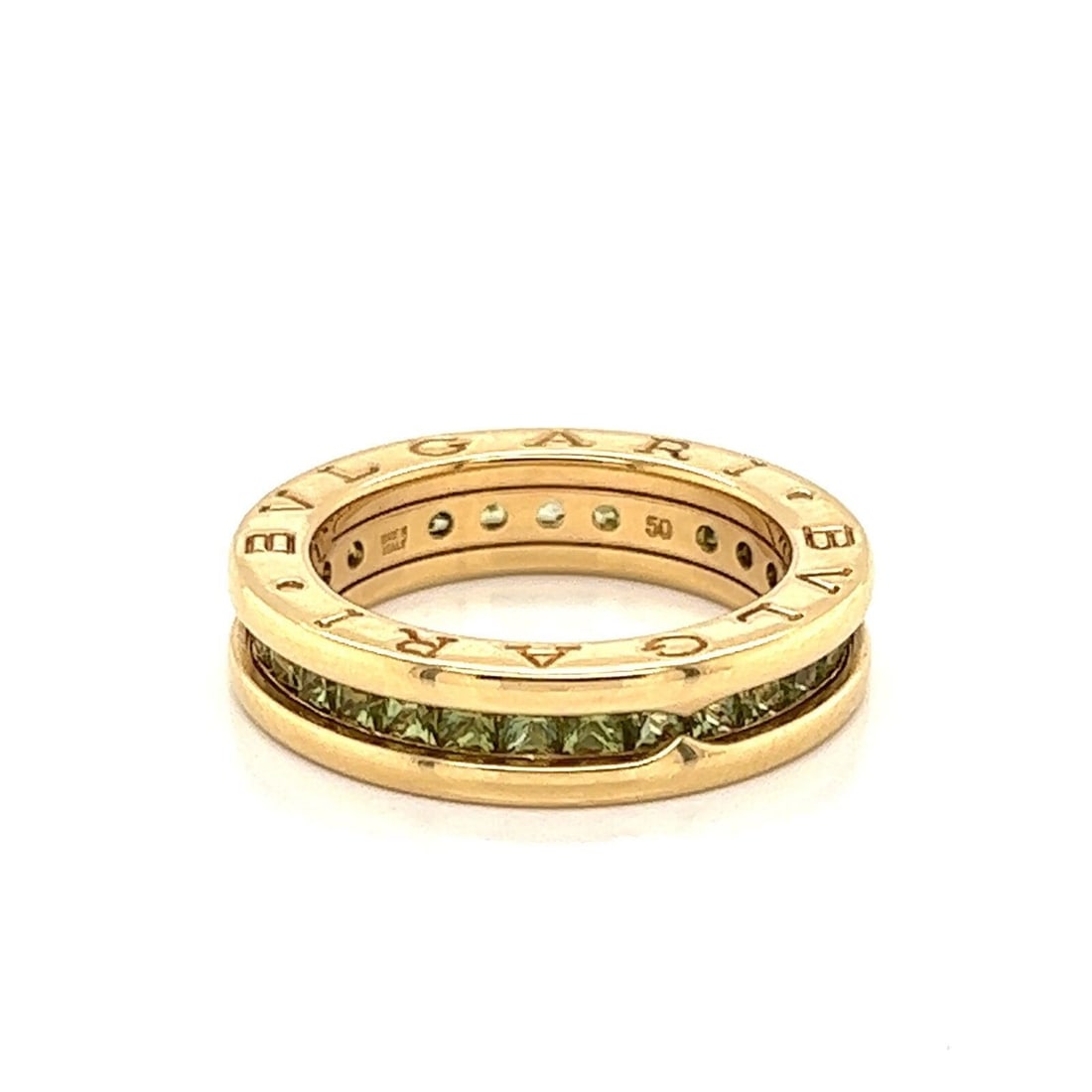 B.zero1 Eternity Band Ring in 18k Yellow Gold with Green Peridot Size 5: B.zero1 Eternity Band Ring in 18k Yellow Gold with Green Peridot Size 5 This Bvlgari B.zero1 Eternity Band Ring is crafted from 18k yellow gold and features green peridot gemstones. The ring is signed