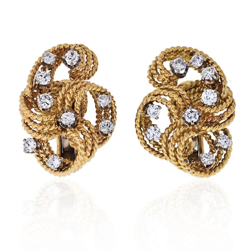David Webb Platinum 18K Gold Twisted Diamond Earrings 2 Cts: David Webb Platinum 18K Gold Twisted Diamond Earrings 2 Cts Discover the elegance of these David Webb earrings, crafted from a stunning combination of platinum and 18K yellow gold. Each earring featur
