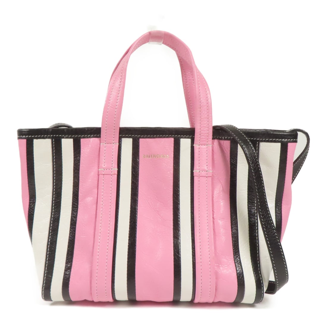 BALENCIAGA Barbes 2-Way Shoulder Bag Pink Calfskin Leather: BALENCIAGA Barbes 2-Way Shoulder Bag Pink Calfskin Leather Elevate your accessory game with the BALENCIAGA Barbes Bag, a versatile 2-way shoulder bag crafted from luxurious calfskin leather. This styl