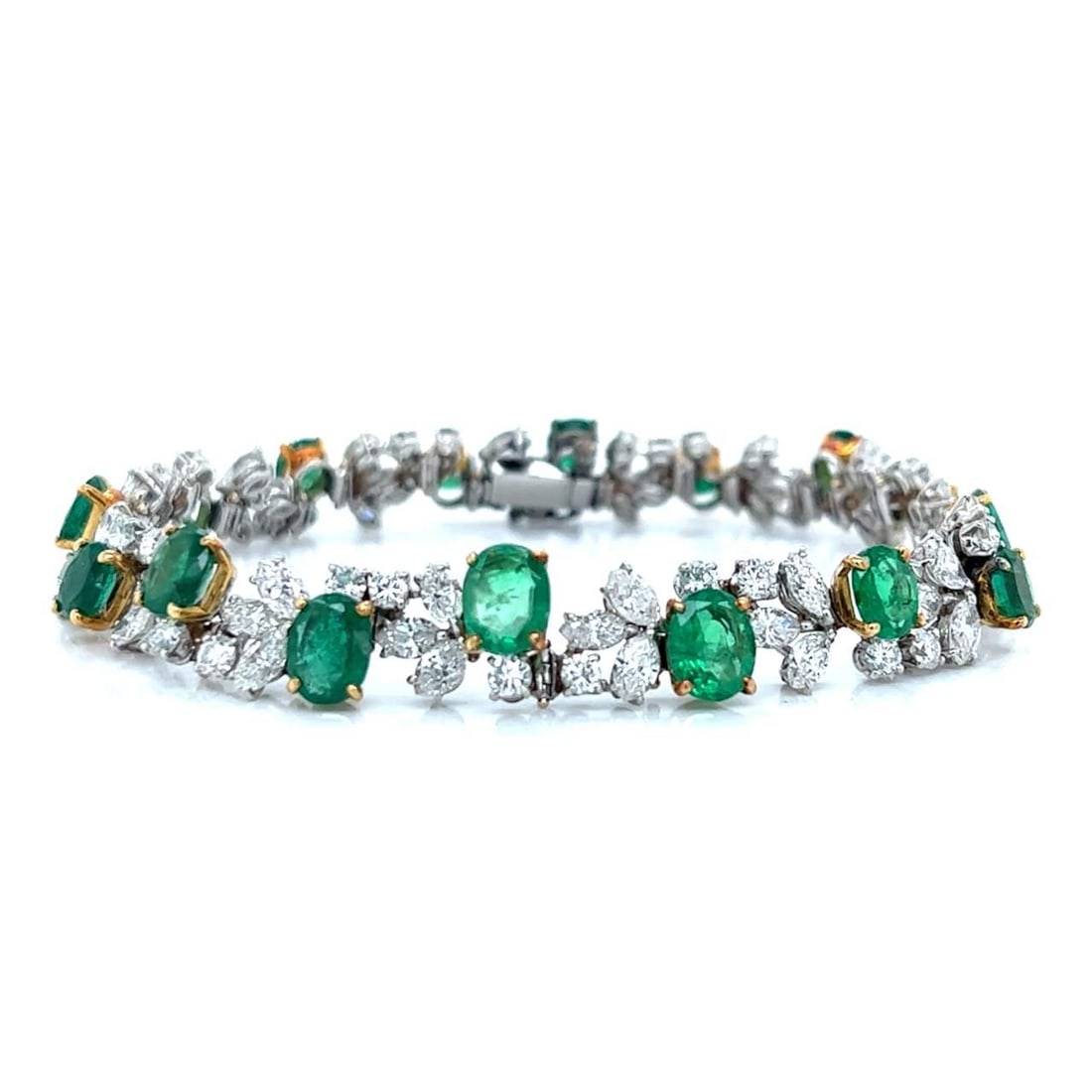 Elegant Platinum 18K Colombian Emerald Diamond Bracelet 16 Emeralds 80 Diamonds: Elegant Platinum 18K Colombian Emerald Diamond Bracelet 16 Emeralds 80 Diamonds This exquisite bracelet features a stunning combination of platinum and 18K gold, elegantly showcasing 16 Colombian emer