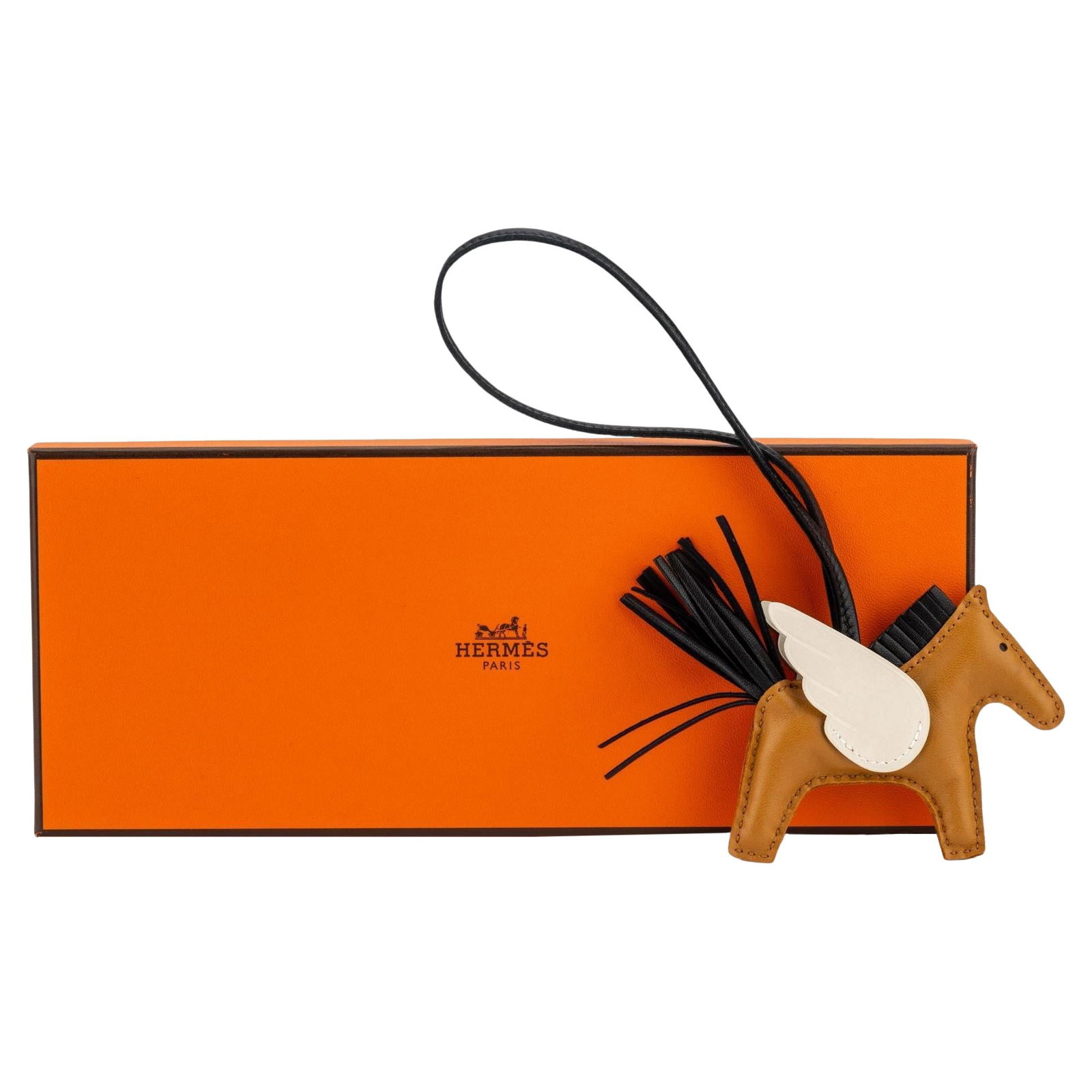 Hermes Limited Edition Rodeo Pegase Charm Gold Black Nata: Hermes Limited Edition Rodeo Pegase Charm Gold Black Nata Introducing the Hermes Rodeo Pegase Charm, a stunning limited edition piece that embodies luxury and style. This small charm features a chic d