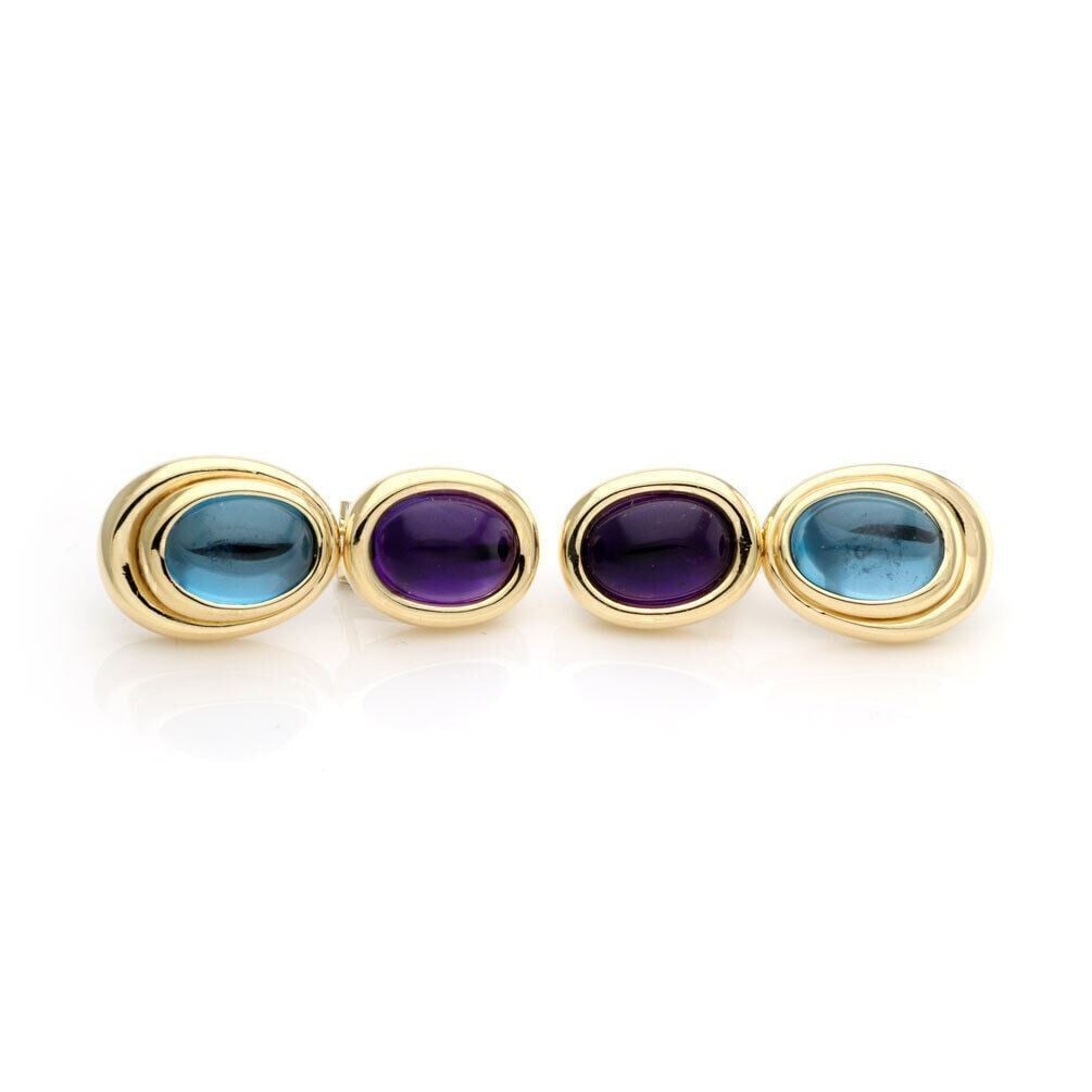 Dangle Earrings with Amethyst and Blue Topaz in 18k Yellow Gold by H Stern: Dangle Earrings with Amethyst and Blue Topaz in 18k Yellow Gold by H Stern These vintage H. Stern earrings feature a sophisticated dangle/drop design with two oval tiers. Crafted from 18k yellow gold,