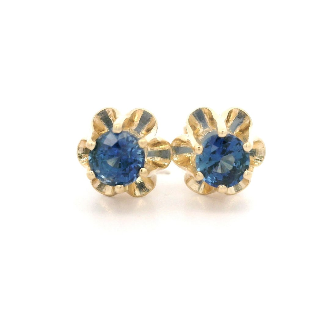 14k Yellow Gold 1.05ctw Blue Sapphire Stud Earrings Buttercup Set: 14k Yellow Gold 1.05ctw Blue Sapphire Stud Earrings Buttercup Set Elevate your style with these exquisite stud earrings, featuring two natural genuine sapphires set in a beautiful buttercup prong desi