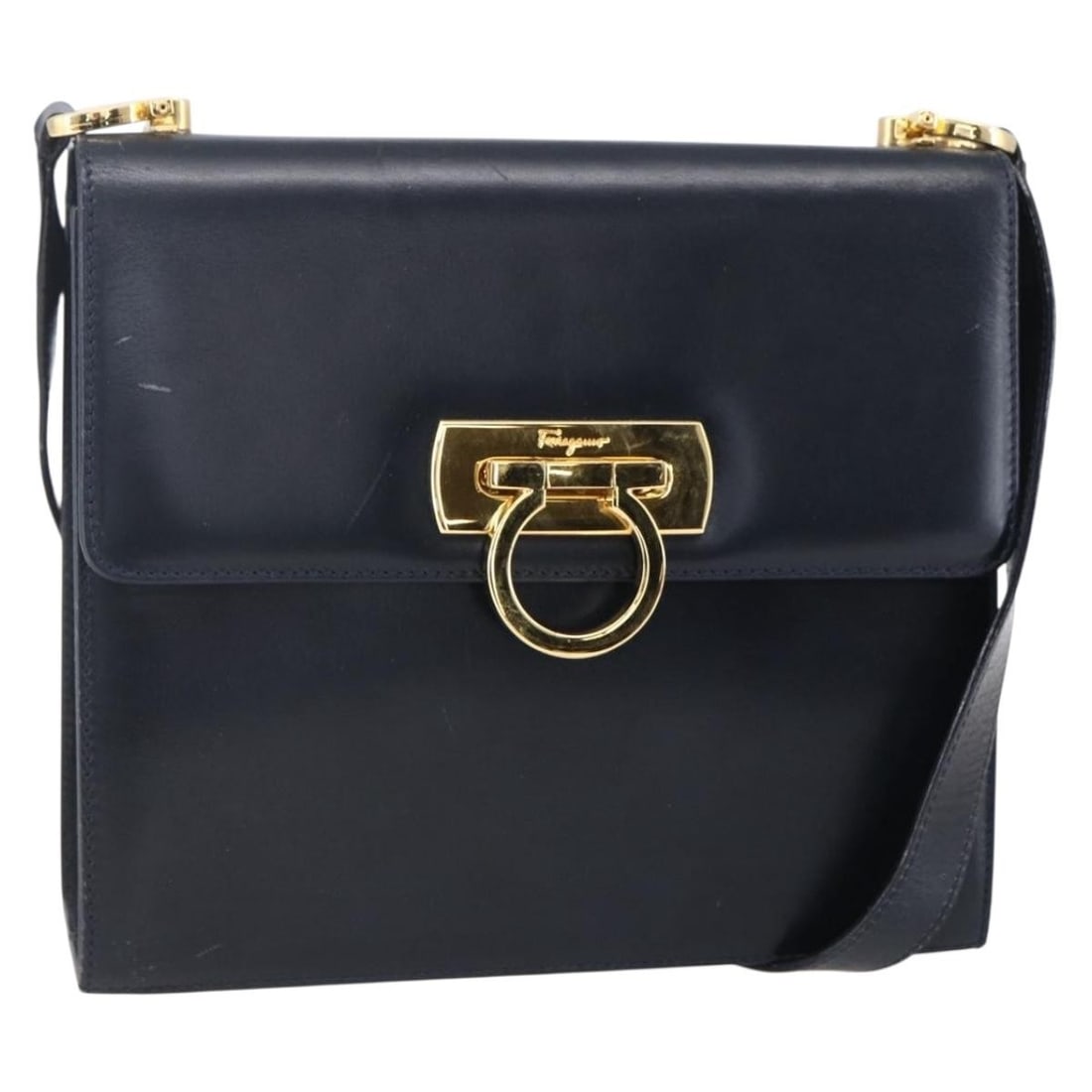Gancini Leather Navy Shoulder Bag by Salvatore Ferragamo: Gancini Leather Navy Shoulder Bag by Salvatore Ferragamo This Salvatore Ferragamo Gancini shoulder bag is crafted from navy leather and designed for women. It features a classic silhouette with a spac
