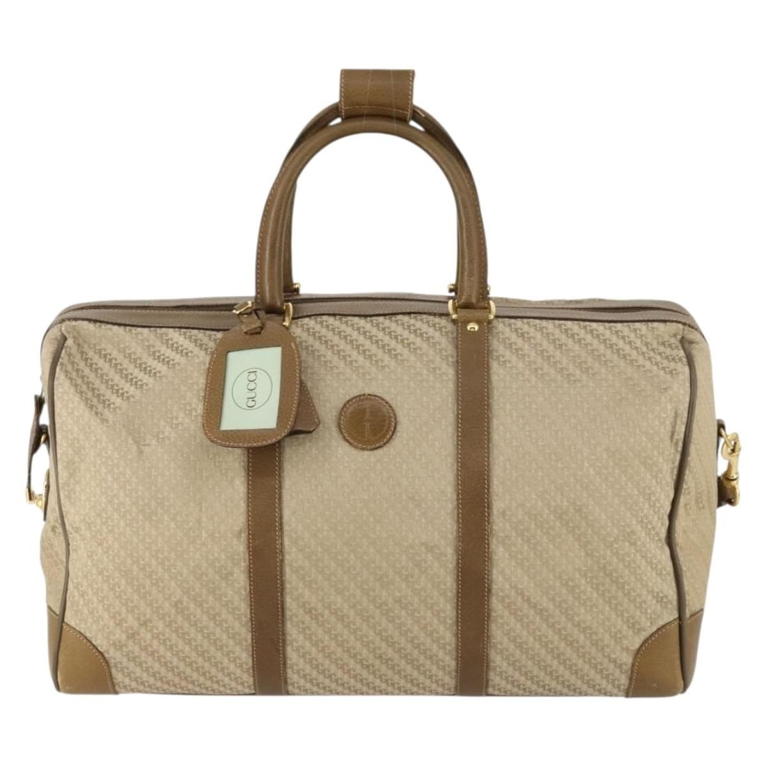 Vintage Gucci Canvas Boston Handbag Beige 50cm: Vintage Gucci Canvas Boston Handbag Beige 50cm This vintage Gucci Boston bag for women features a beige canvas exterior with leather handles and a shoulder strap. It shows signs of wear including rubb