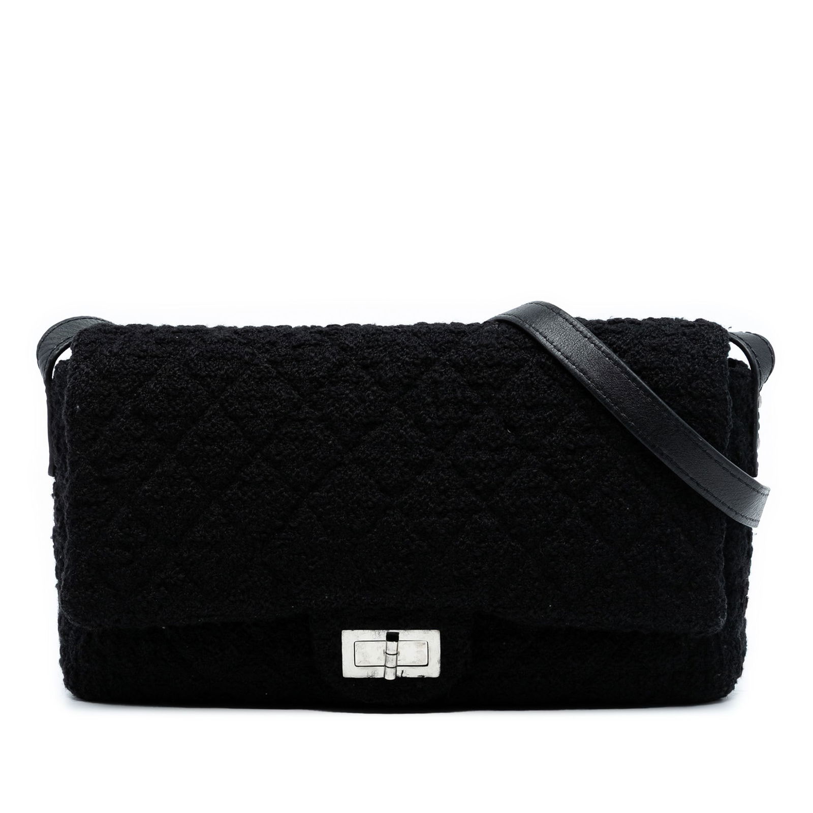 Chanel Jumbo Reissue 2.55 Quilted Tweed Crossbody Bag Black: Chanel Jumbo Reissue 2.55 Quilted Tweed Crossbody Bag Black This iconic Chanel Jumbo Reissue 2.55 Quilted Tweed Easy Messenger Flap bag showcases a stylish tweed body complemented by an adjustable fla