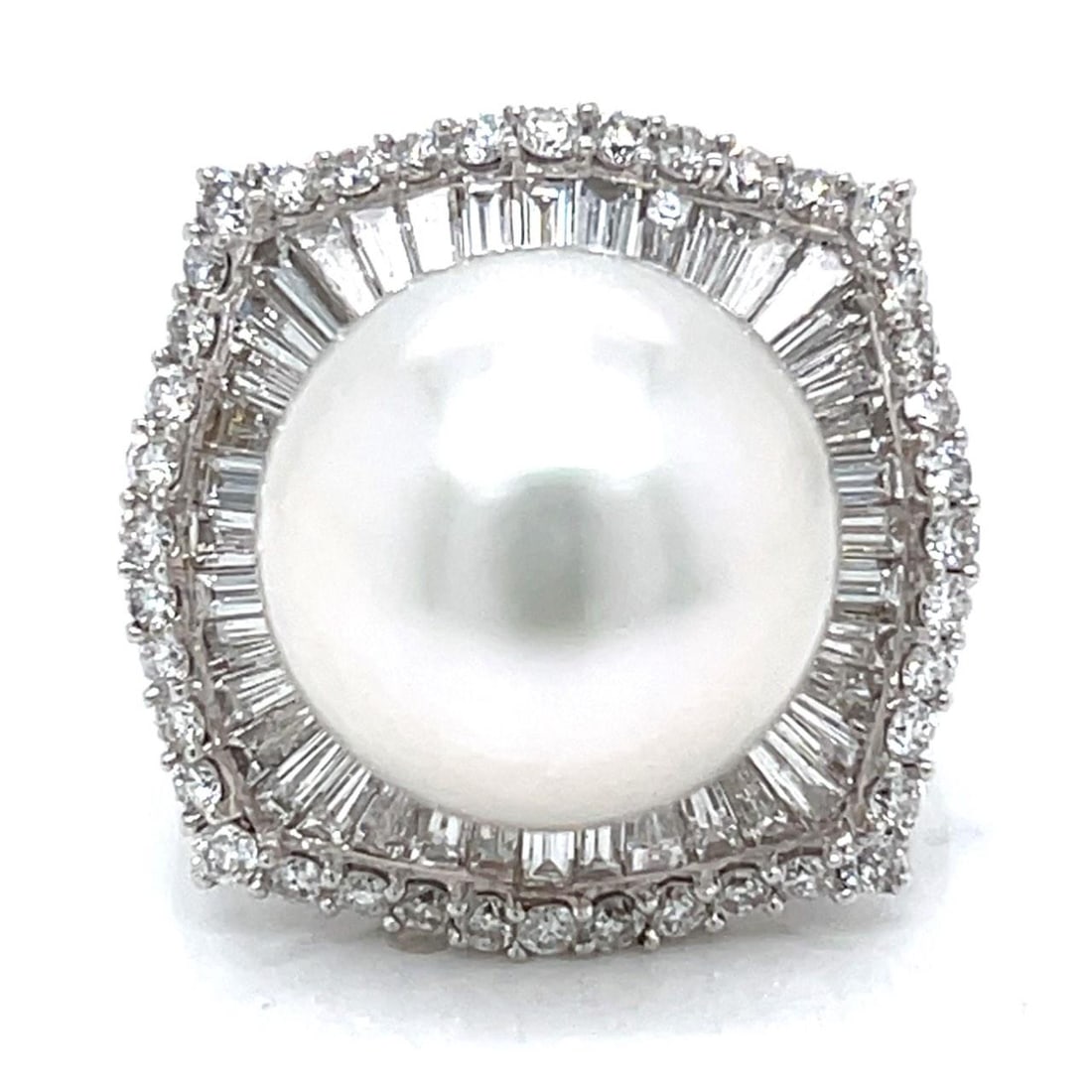 South Sea Pearl and Diamond Baguette Ring in 18K White Gold Size 8: South Sea Pearl and Diamond Baguette Ring in 18K White Gold Size 8 This elegant ring features a 13.9mm South Sea pearl set in 18K white gold. The design is accented with 46 baguette diamonds totaling