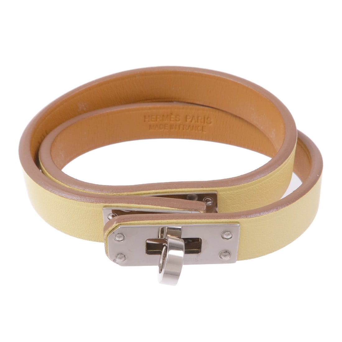 HERMES Kelly Double Tour Bracelet Veau Swift Leather Yellow: HERMES Kelly Double Tour Bracelet Veau Swift Leather Yellow This elegant HERMES Kelly Double Tour Bracelet is crafted from luxurious Veau Swift leather in a soft pale yellow hue. Known for its excepti
