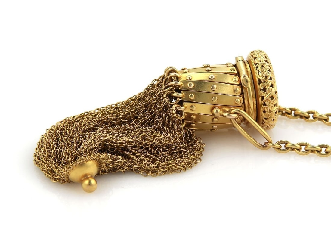 Antique 21k Yellow Gold Mesh Purse With Corkscrew Top: Antique 21k Yellow Gold Mesh Purse With Corkscrew Top This antique mesh purse features a 21k yellow gold construction with a distinctive cork screw top design. The purse showcases intricate mesh detai