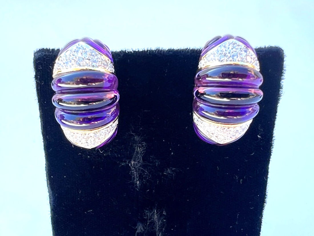 French 18K Yellow Gold Diamond Amethyst Clip-On Earrings: French 18K Yellow Gold Diamond Amethyst Clip-On Earrings Adorn yourself with this exquisite pair of French clip-on earrings crafted from 18K yellow gold. Each earring features a stunning combination o