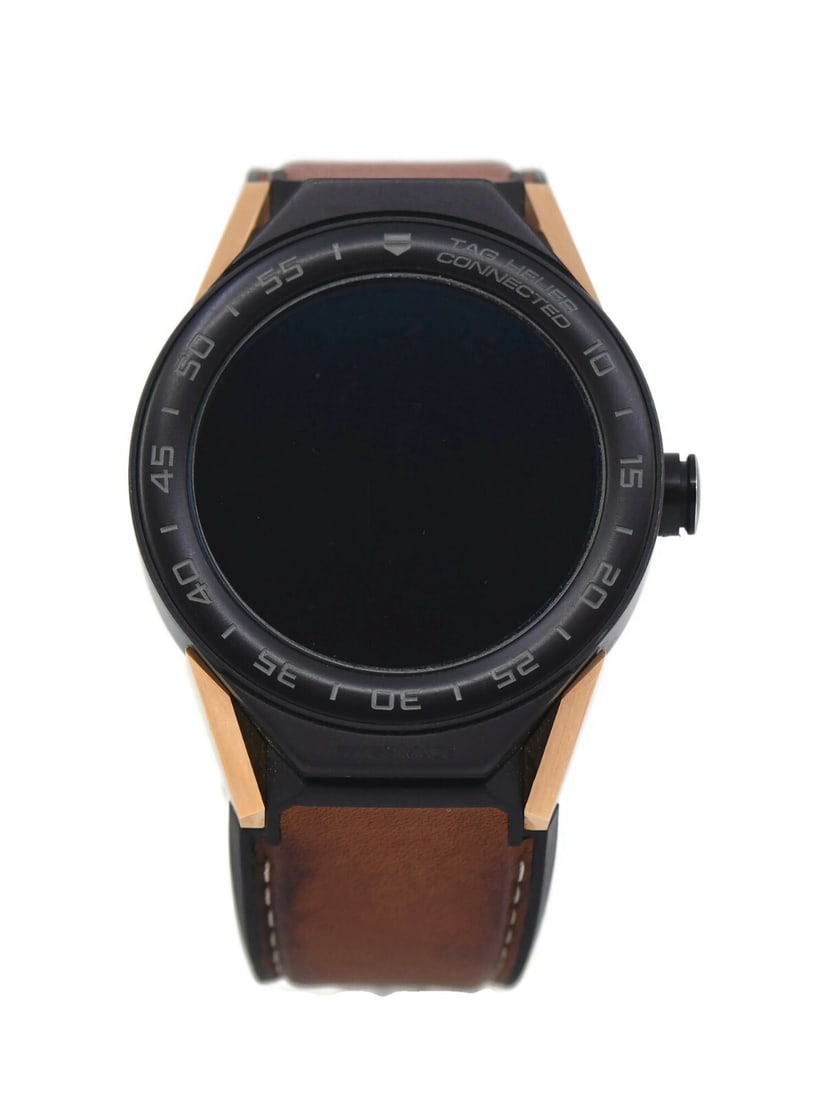 TAG Heuer Connected Kingsman Titanium Watch 45mm SBF8A8023 with Box and Papers: TAG Heuer Connected Kingsman Titanium Watch 45mm SBF8A8023 with Box and Papers Presenting the TAG Heuer Connected Kingsman Titanium Watch, a remarkable fusion of luxury and technology. This wristwatch