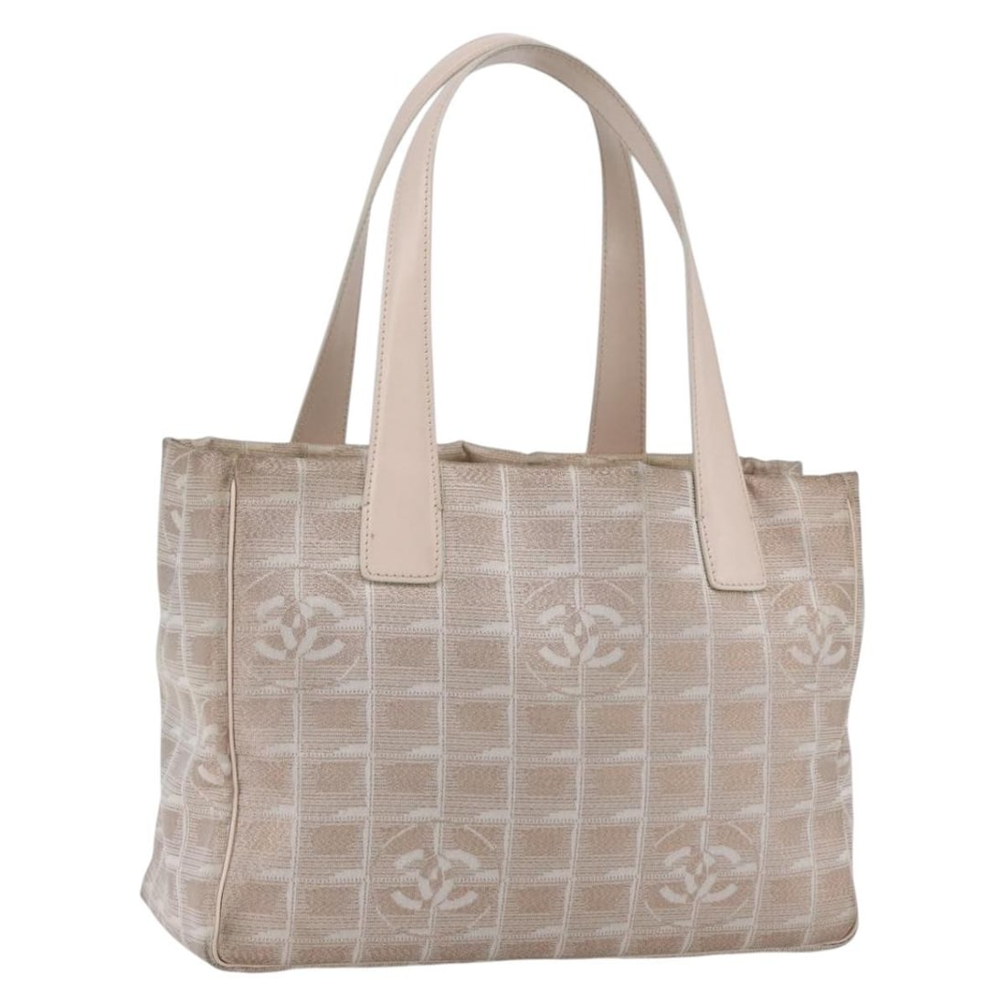 Beige Silver Nylon CHANEL New Travel Line Tote Handbag from Italy: Beige Silver Nylon CHANEL New Travel Line Tote Handbag from Italy This CHANEL Travel Line tote bag features a beige and silver nylon exterior with signature CC accents. The bag offers a spacious inter