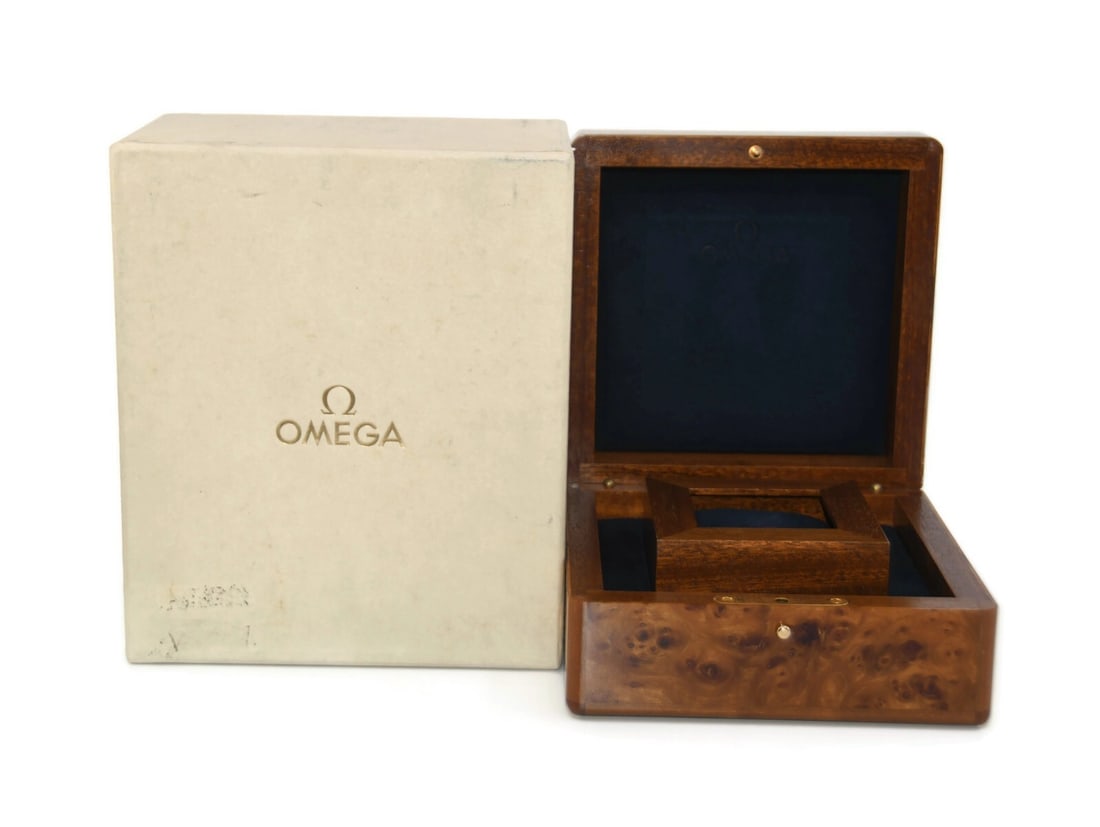 Authentic Omega Wooden Presentation Watch Box 9x7x5 Inches: Authentic Omega Wooden Presentation Watch Box 9x7x5 Inches This elegant Omega Wooden Watch Box is perfect for presenting or storing your timepiece. Crafted with a rich brown finish, this presentation