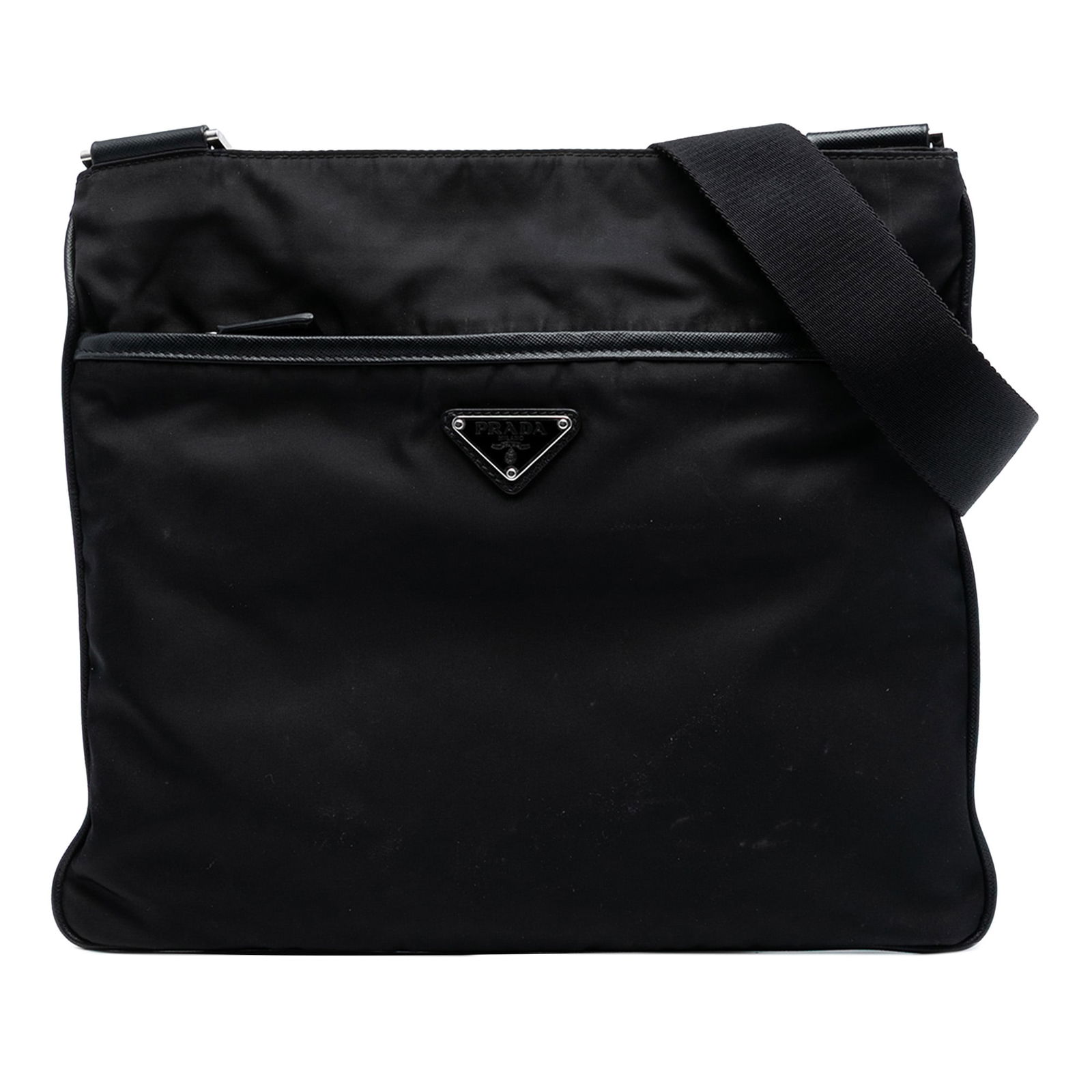 Black Prada Tessuto Nylon Crossbody Bag with Adjustable Strap: Black Prada Tessuto Nylon Crossbody Bag with Adjustable Strap This Prada Tessuto Zip Top Crossbody bag features a black nylon body with a flat adjustable strap. It is designed with a top zip closure,