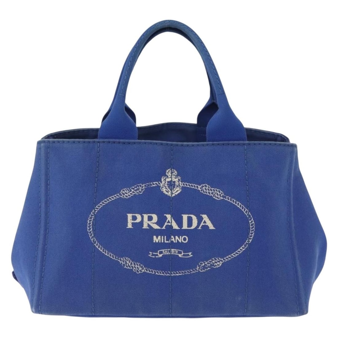 Blue Canapa Open Tote Bag by Prada in Canvas: Blue Canapa Open Tote Bag by Prada in Canvas This Prada Canapa Open Tote is crafted from blue canvas and designed for women. The bag features a spacious interior, sturdy handles, and metal fittings. I