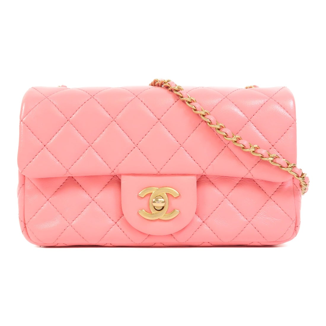 Pink Lambskin Mini Classic Shoulder Bag by CHANEL with Gold Hardware: Pink Lambskin Mini Classic Shoulder Bag by CHANEL with Gold Hardware This CHANEL Mini Classic 20 chain shoulder bag is crafted from pink lambskin leather and features the signature CC logo. It is desi