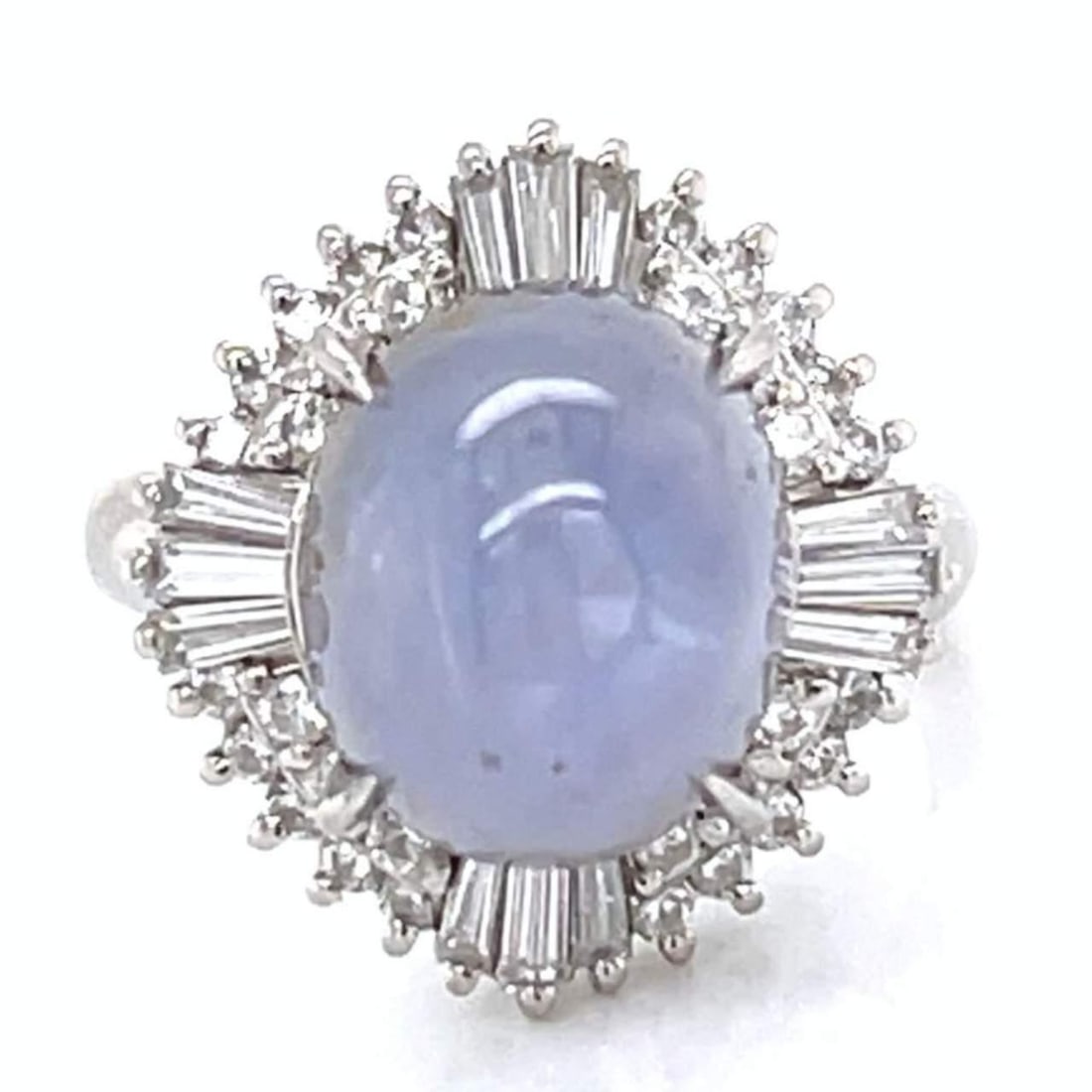 Platinum Star Sapphire 16.83 Ct with 0.96 Ct Diamonds Ring: Platinum Star Sapphire 16.83 Ct with 0.96 Ct Diamonds Ring This exquisite ring features a stunning 16.83 Ct. star sapphire, beautifully complemented by 0.96 Ct. of diamonds. The diamonds exhibit F-G c