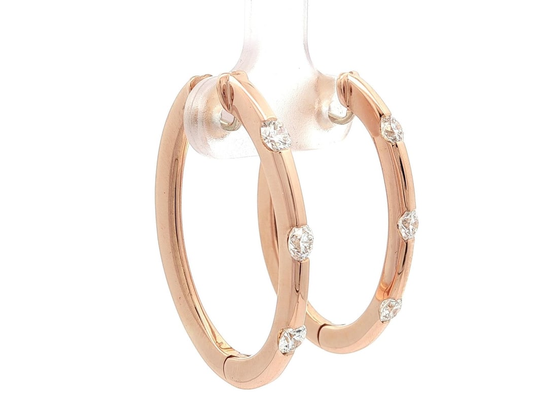 Oval 18k Rose Gold Hoop Earrings with 0.90ctw Diamonds by Roberto Coin: Oval 18k Rose Gold Hoop Earrings with 0.90ctw Diamonds by Roberto Coin These oval hoop earrings by Roberto Coin are crafted from 18k solid rose gold and feature a total of six natural round brilliant