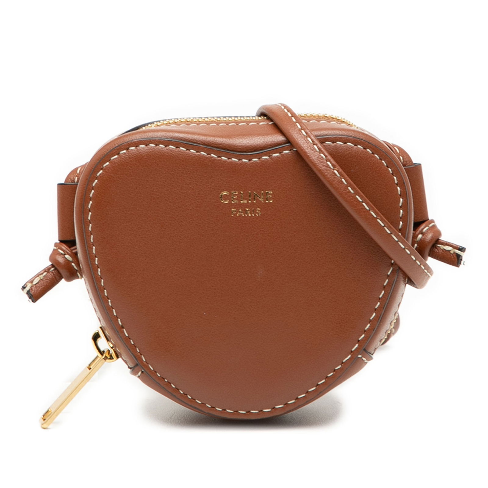 Celine Micro Leather Heart Crossbody Bag in Brown: Celine Micro Leather Heart Crossbody Bag in Brown Introducing the Celine Micro Leather Heart Crossbody, a stylish accessory crafted from premium leather. This elegant bag features a sleek leather body