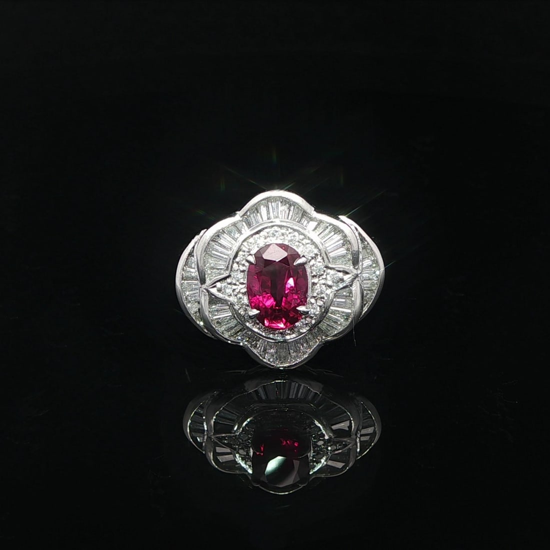GIA Certified Platinum Ring With No Heat 1.37ct Oval Ruby and Baguette Diamonds: GIA Certified Platinum Ring With No Heat 1.37ct Oval Ruby and Baguette Diamonds This platinum tiered cocktail ring features a natural, no-heat oval ruby weighing 1.37 carats, accompanied by round bril