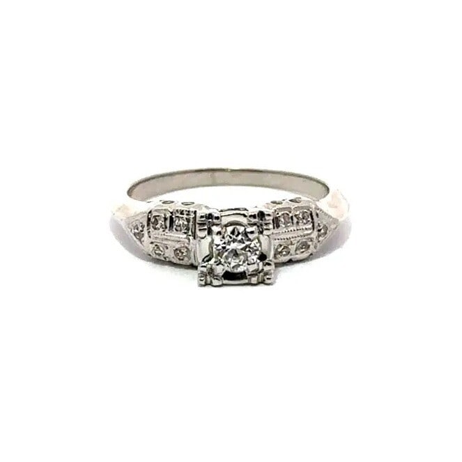 Antique 1940s 14K White Gold Diamond Solitaire Engagement Ring: Antique 1940s 14K White Gold Diamond Solitaire Engagement Ring This exquisite antique engagement ring from the 1940s features a stunning 14K white gold band adorned with a brilliant solitaire diamond.