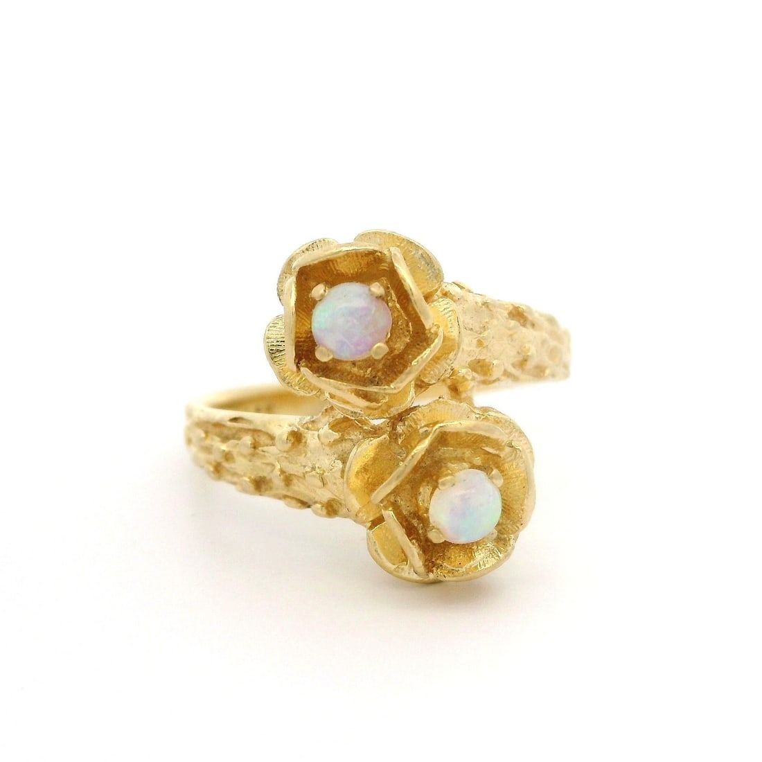 Vintage Floral Bypass Ring in Solid Yellow Gold with Cabochon Opal: Vintage Floral Bypass Ring in Solid Yellow Gold with Cabochon Opal This exquisite vintage ring features a beautiful bypass design crafted in solid yellow gold, showcasing two natural genuine opals. Th