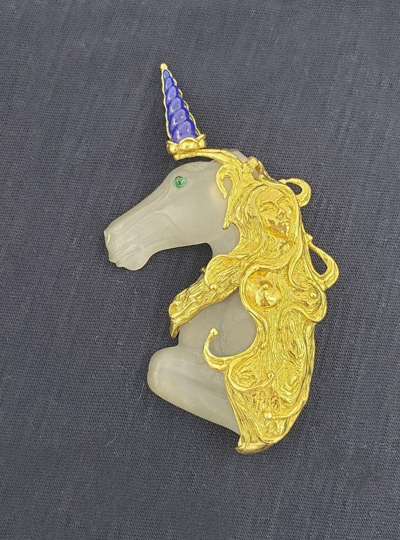 Art Nouveau 14k Gold Unicorn Brooch with Lapis and Emerald: Art Nouveau 14k Gold Unicorn Brooch with Lapis and Emerald This stunning Art Nouveau brooch features a beautifully carved unicorn head and neck crafted from frosted camphor glass. A detailed sculpted
