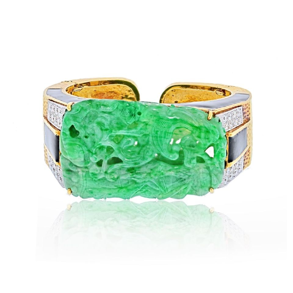 David Webb 18K Gold Platinum Jade Cuff Bracelet with Diamonds: David Webb 18K Gold Platinum Jade Cuff Bracelet with Diamonds This exquisite cuff bracelet by David Webb showcases a stunning combination of platinum and 18K yellow gold. The centerpiece features a be