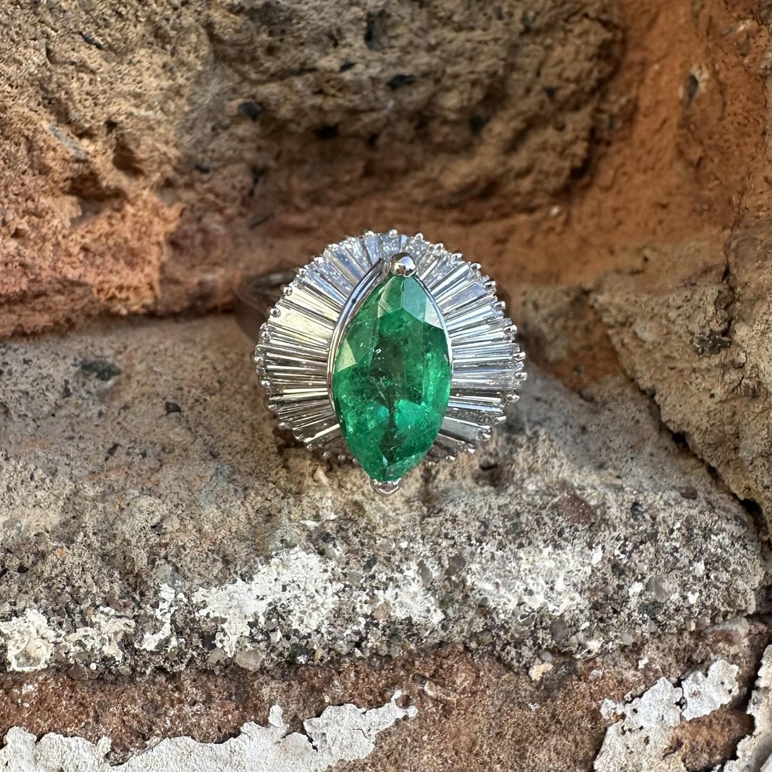 Platinum Cocktail Ring with GIA Colombian Marquise Emerald and Diamond Halo: Platinum Cocktail Ring with GIA Colombian Marquise Emerald and Diamond Halo This platinum cocktail ring features a GIA-certified natural Colombian emerald in a unique marquise cut, weighing exactly 1.