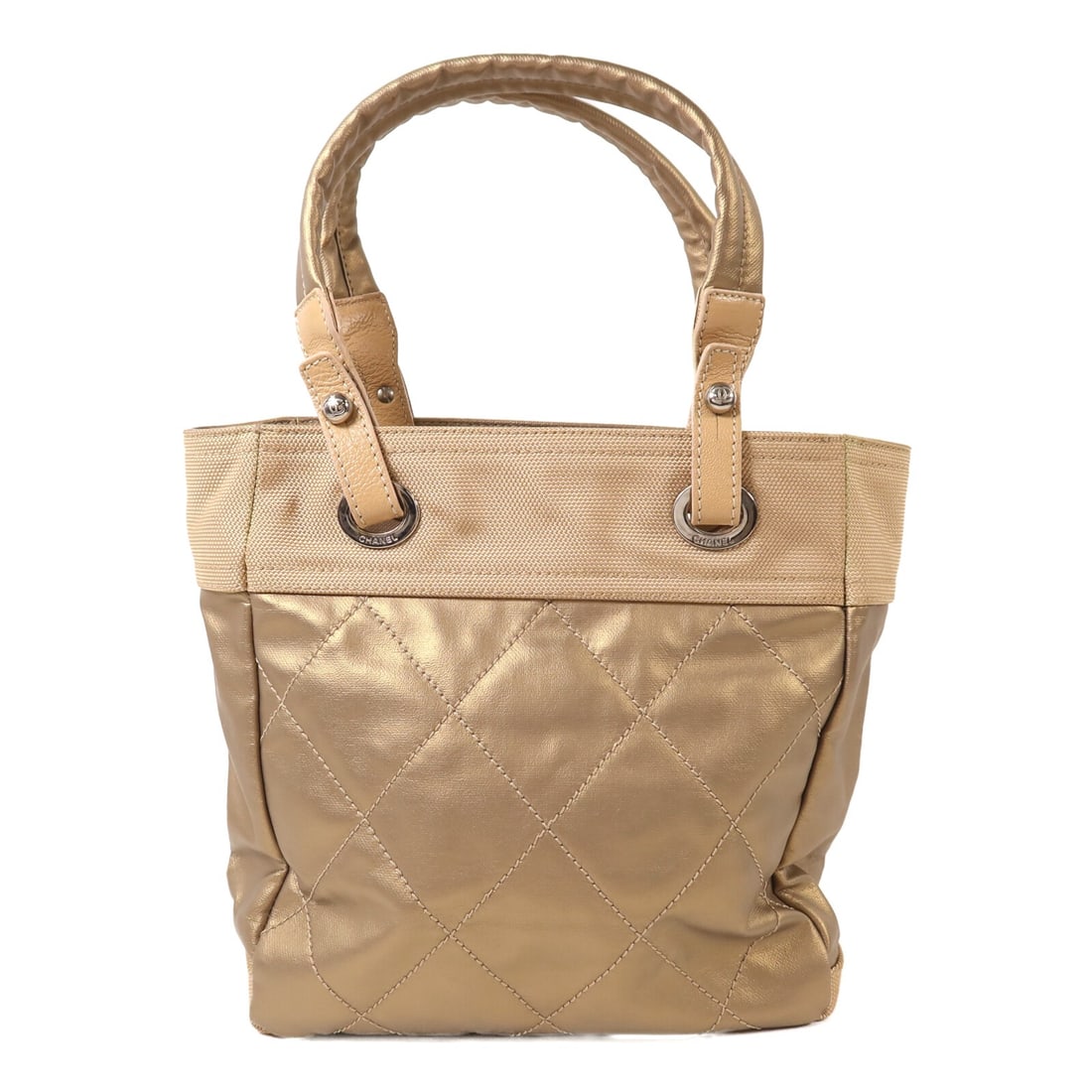 Chanel Gold Coated Canvas and Nylon CC Handbag with Silver Tone Hardware: Chanel Gold Coated Canvas and Nylon CC Handbag with Silver Tone Hardware This CHANEL handbag features a stylish gold PVC coated canvas exterior and nylon detailing. Made in France, it offers a regular