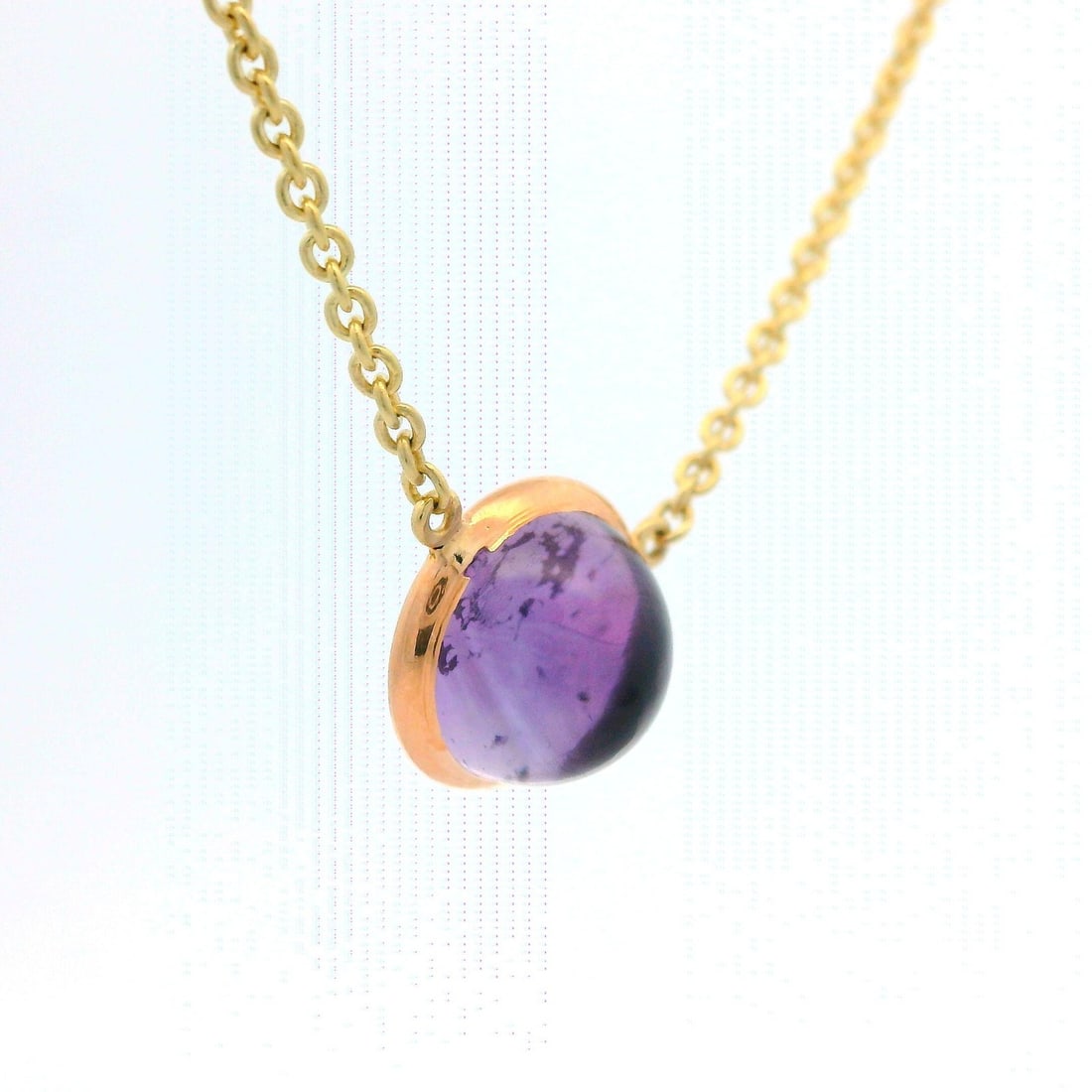 Vintage 13k Yellow Gold Amethyst Cabochon Solitaire Necklace: Vintage 13k Yellow Gold Amethyst Cabochon Solitaire Necklace This vintage necklace features a stunning bezel-set natural genuine amethyst, shaped as a round cabochon in a medium purple color. Crafted