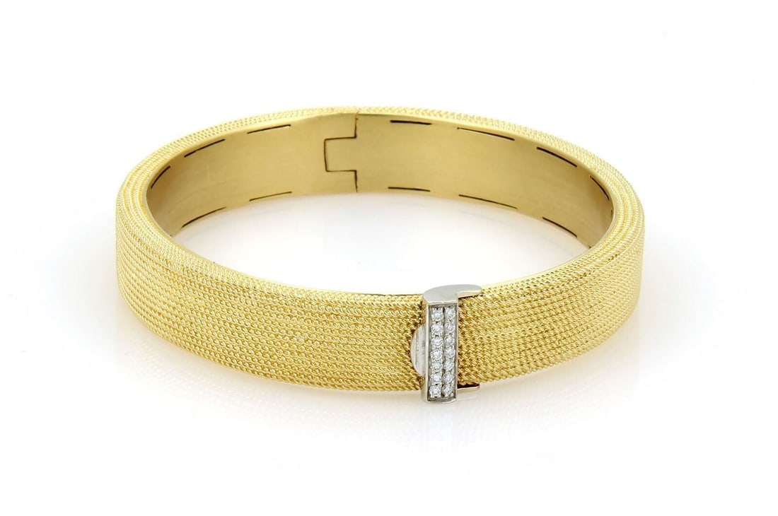 Wide Textured Two-Tone 18k Gold Diamond Bangle by Roberto Coin: Wide Textured Two-Tone 18k Gold Diamond Bangle by Roberto Coin This authentic Roberto Coin wide bangle bracelet is crafted in solid 18k yellow and white gold, featuring a richly textured finish accent