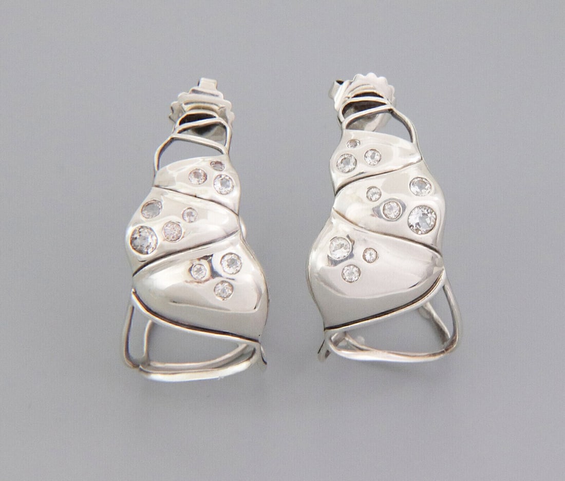 Sterling Silver Diamond Hoop Earrings John Hardy Bamboo Collection: Sterling Silver Diamond Hoop Earrings John Hardy Bamboo Collection These John Hardy large hoop earrings from the Bamboo Collection are expertly handcrafted in sterling silver and feature the distincti