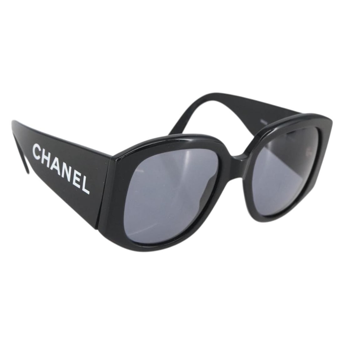 Black Plastic Sunglasses by CHANEL with CC Logo and Case: Black Plastic Sunglasses by CHANEL with CC Logo and Case These CHANEL sunglasses feature a classic black plastic frame with the iconic CC logo. Made in Italy, the sunglasses come with a matching case.