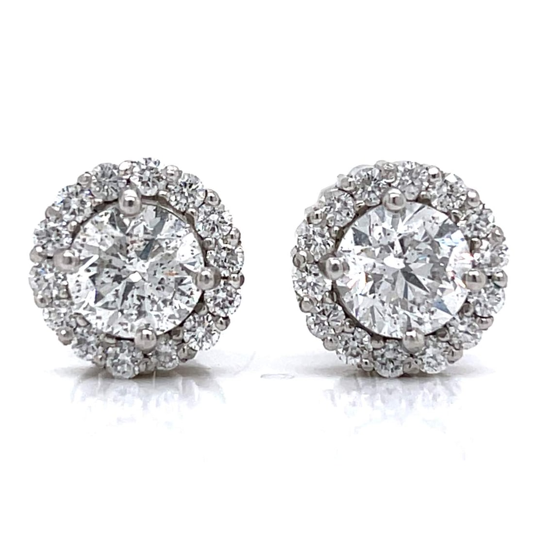 Platinum Diamond Earrings 4.01 Ct E-F SI2-SI3 with 28 Accent Diamonds: Platinum Diamond Earrings 4.01 Ct E-F SI2-SI3 with 28 Accent Diamonds These stunning platinum diamond earrings feature a total diamond weight of 4.01 carats, accented with an additional 28 diamonds to