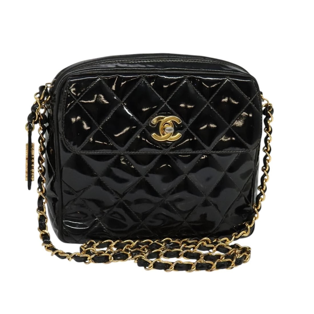 Chanel Patent Leather Camera Bag Vintage Square Front Pocket Black: Chanel Patent Leather Camera Bag Vintage Square Front Pocket Black This vintage Chanel square front pocket camera bag is crafted from black patent leather and features a quilted design. It includes a